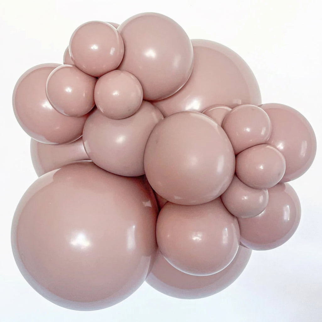 Cluster of pink balloons on a white background