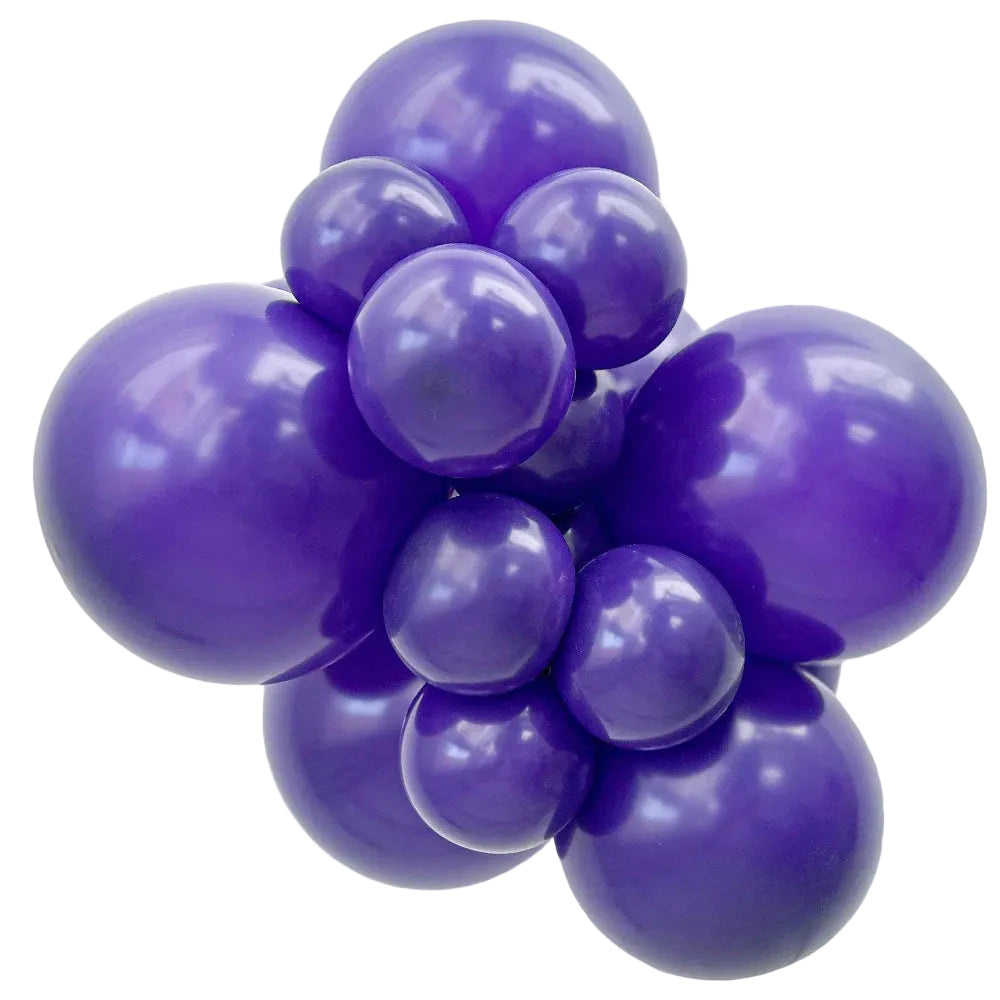 Cluster of purple balloons on a white background