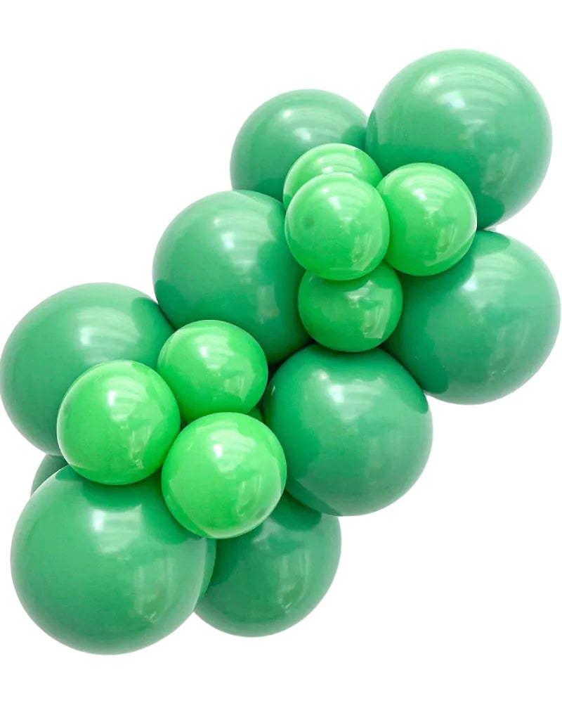 Cluster of green balloons on a white background