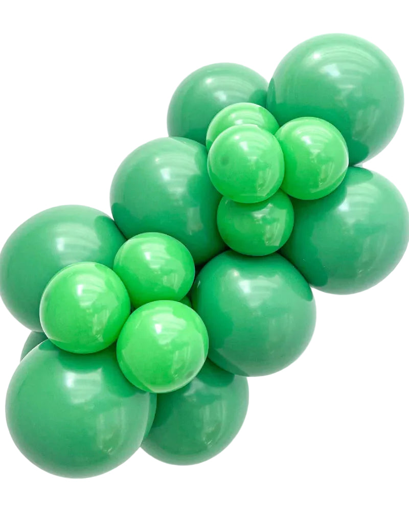 Cluster of green balloons on a white background