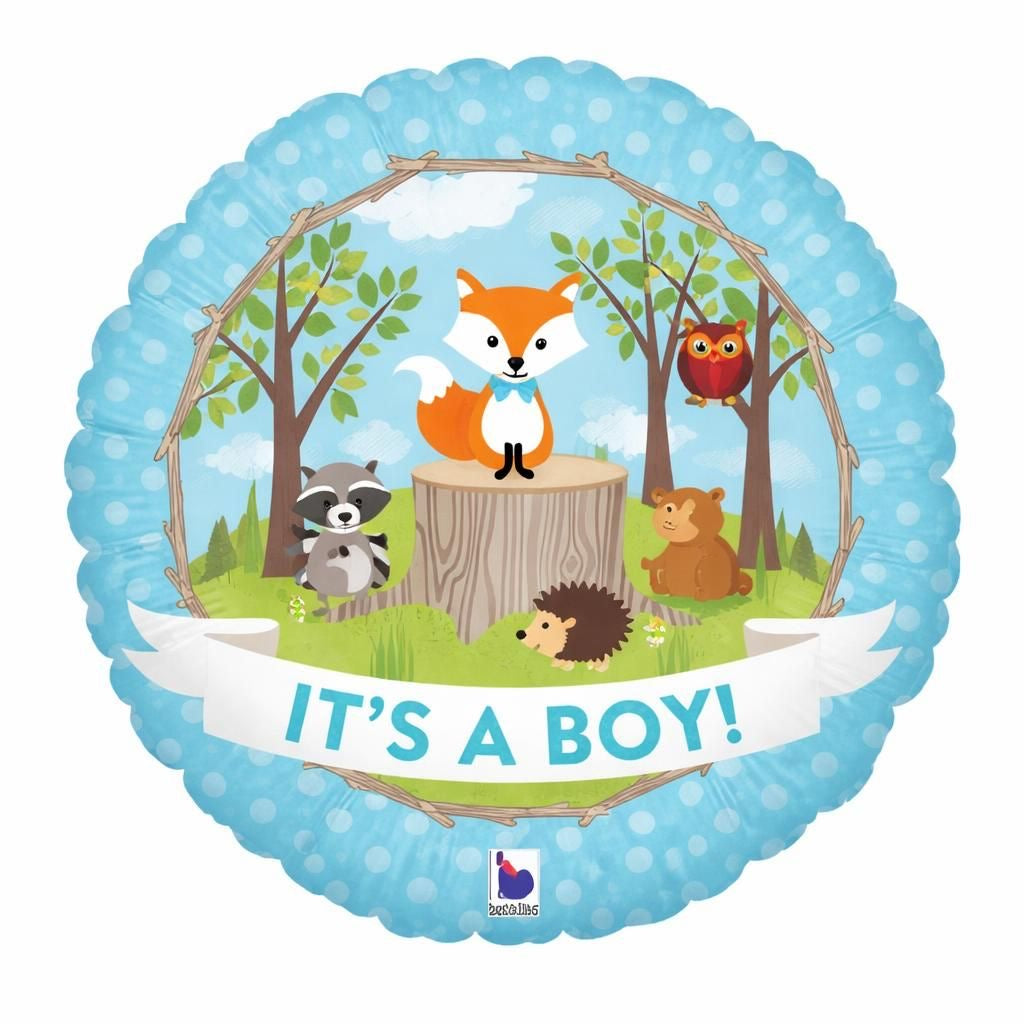 Balloon with forest scene featuring animals and 'It's a Boy!' text on a blue polka dot background
