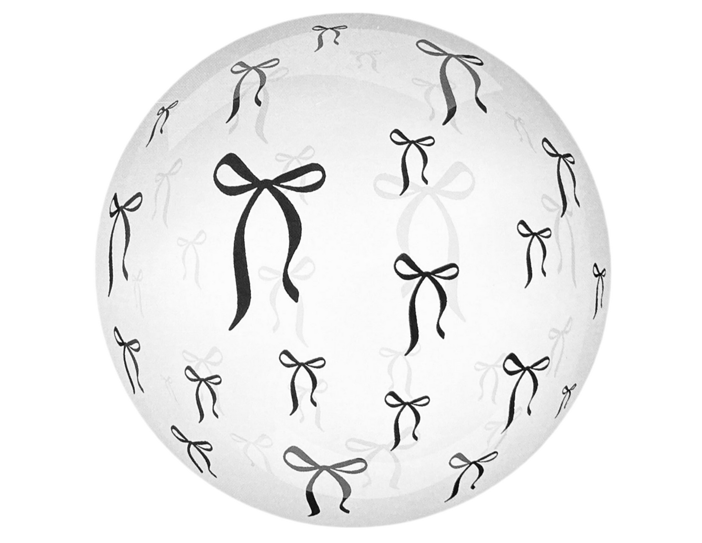 Clear sphere with black bow patterns on a white background
