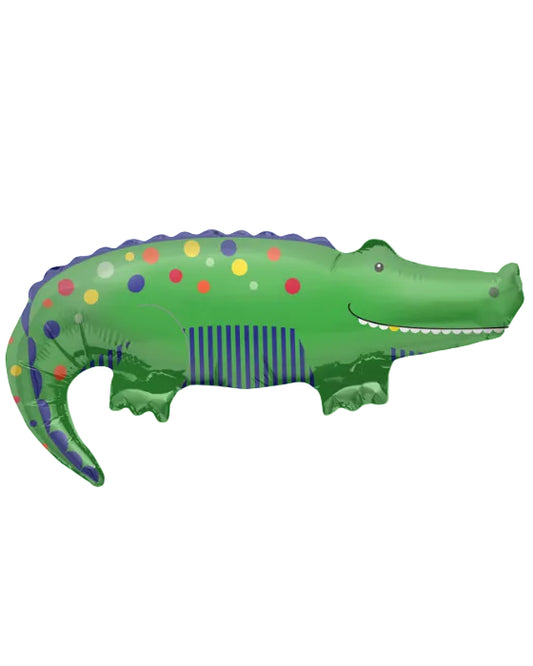 Green alligator-shaped inflatable toy with colorful spots on a white background