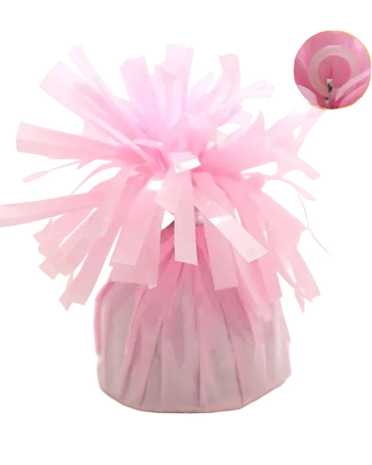 Pink tulle balloon weight on a white background
