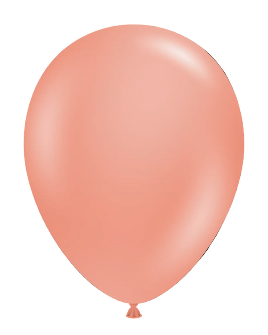 Single peach-colored balloon on a white background