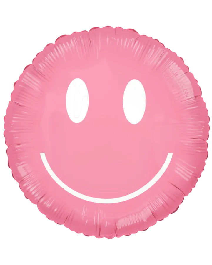 A pink foil balloon shaped like a smiling face, isolated on a white background.