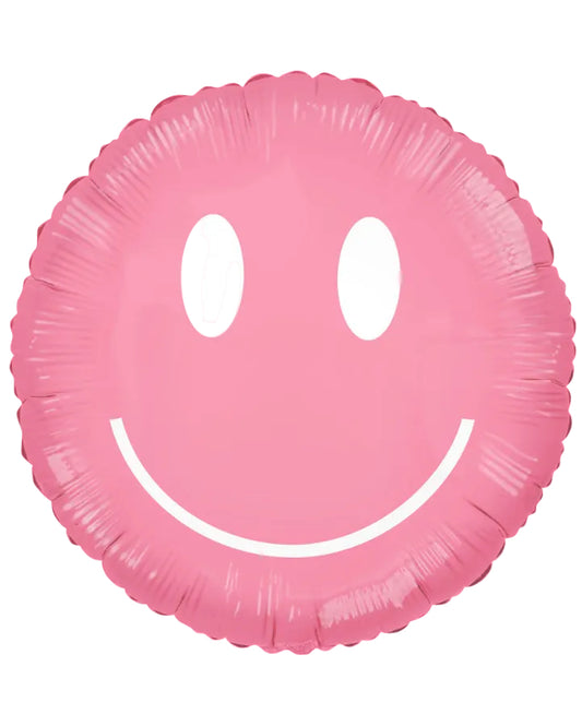 A pink foil balloon shaped like a smiling face, isolated on a white background.