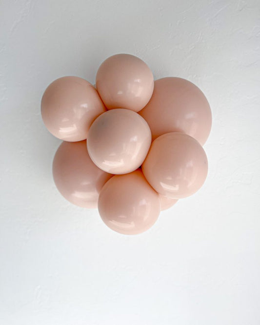 Cluster of pink balloons on a white background