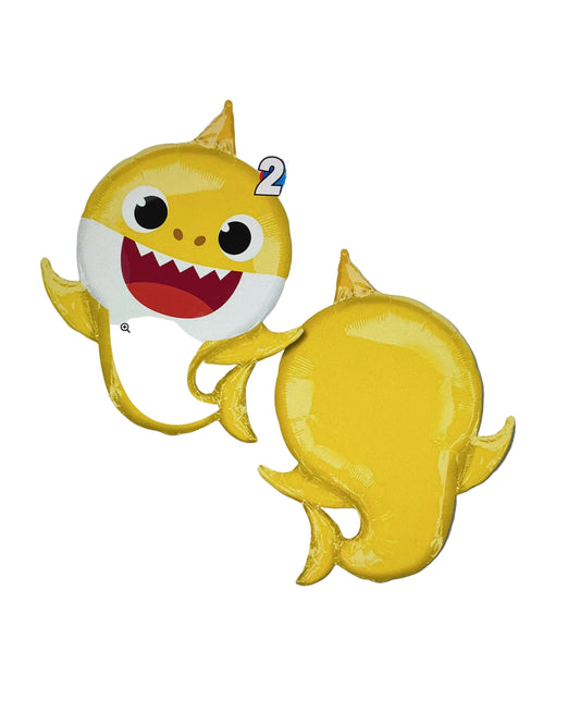 Yellow shark-shaped balloon with a face on a white background