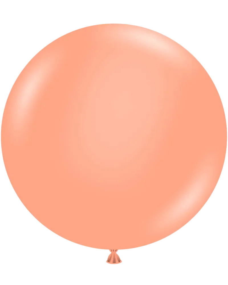 Large peach-colored balloon on a white background