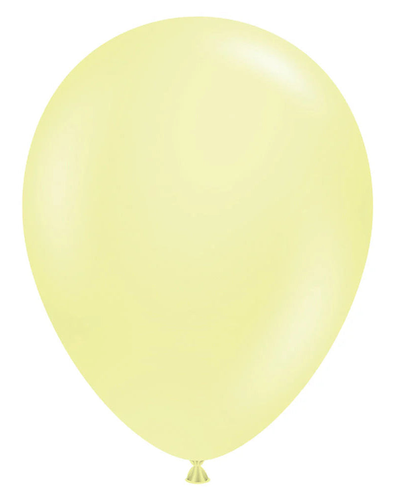 Single light yellow balloon on a white background