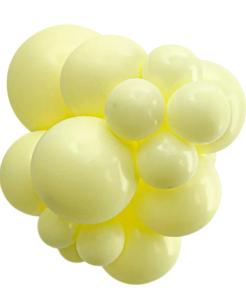 Cluster of light yellow balloons on a white background