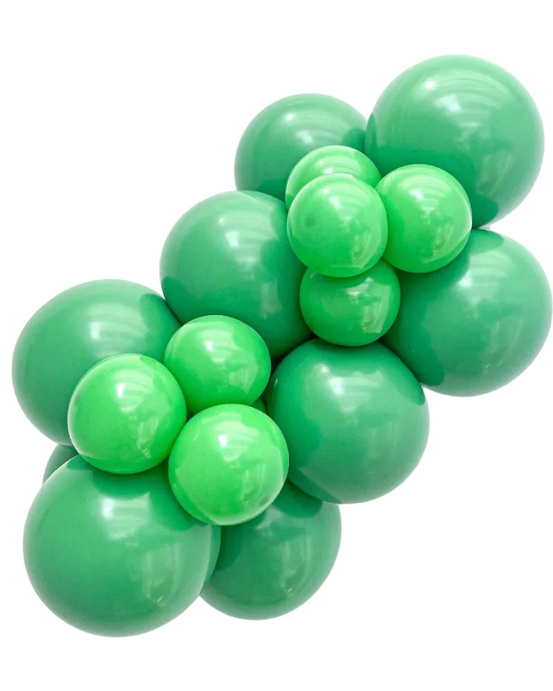 Cluster of green balloons on a white background