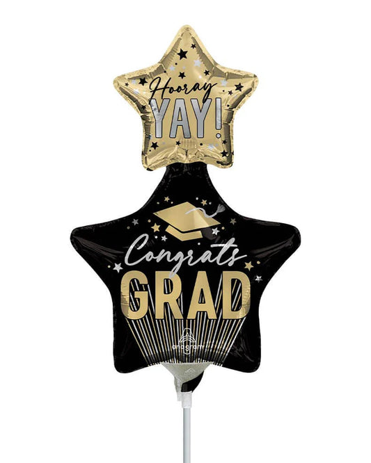 Graduation-themed star-shaped balloon with 'Congrats Grad' text on a white background