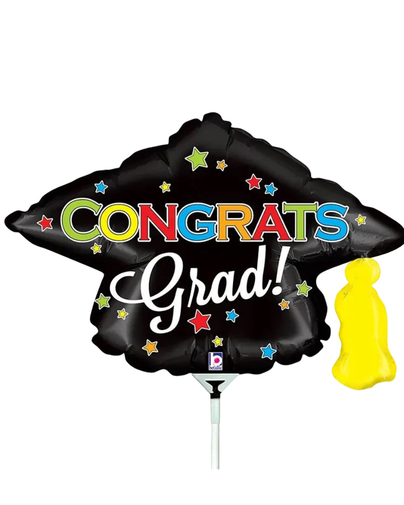 Black graduation cap balloon with 'Congrats Grad!' text on a white background